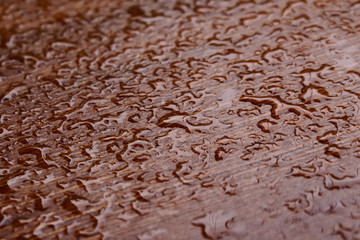 Water drops on  wooden surface