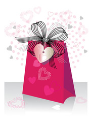 Gift bag with bow and heart shaped tag