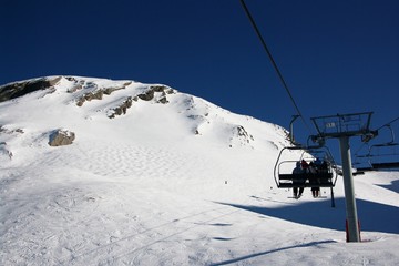 Fototapeta na wymiar view on Alpine mountain ski resort from lift
