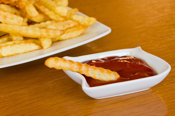 Close-up of french fry in ketchup