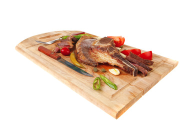 meat steak and red hot pepper  on wood
