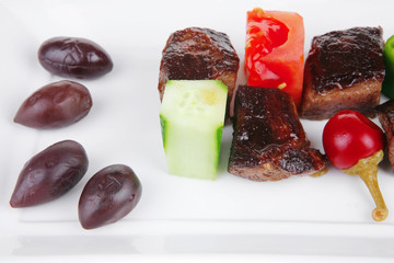european food: grilled beef meat on white china plate