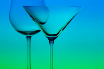 a conceptually illuminated glasses on gradient background