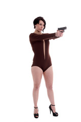 Cute teen girl in a retro body suit with gun