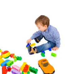 young boy play with bricks