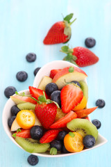 Fruity summer salad in white bowl