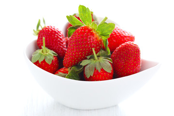 Fresh strawberries in bowl isolated on white background