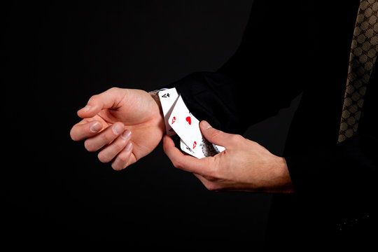 Ace up the sleeve. Gambling, isolated on black
