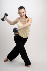 fitness instructor exercising with dumbbell