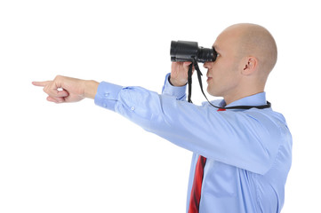 Businessman looking through binoculars