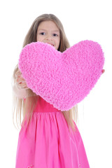 Little girl holding heart