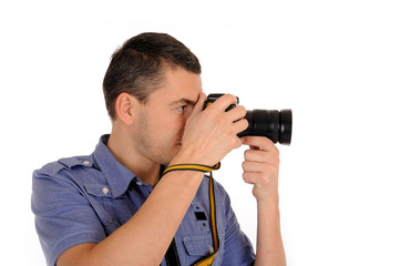professional male photographer taking picture . isolated on whi