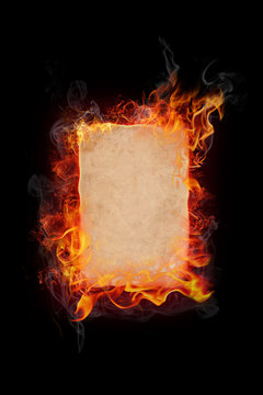 Burning paper on black background
