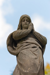 Fototapeta premium Monument Lady of Guadalupe on a cemetery