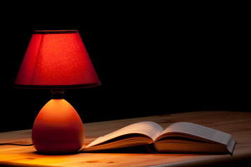 Lamp illuminating a book