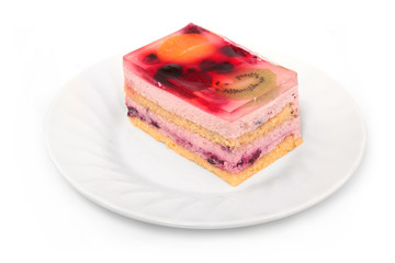Fruit cake on a plate isolated on white