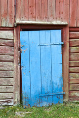 Obraz na płótnie Canvas Old blue wooden door
