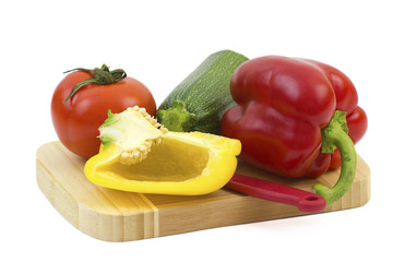 fresh vegetables on a wooden cutting board