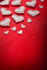 White hearts on red background