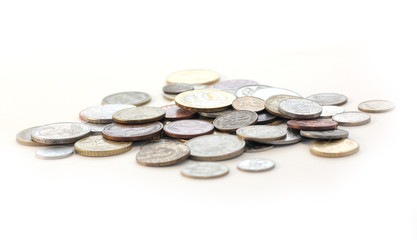 metal coins from different countries on the table