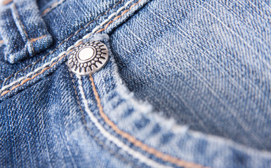 Button on blue jeans