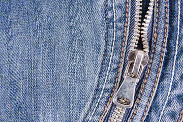 Zipper on denim blue jeans