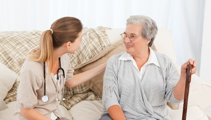 Fototapeta premium Nurse talking with her patient