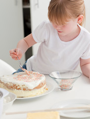 Adorable girl baking in her kitchen