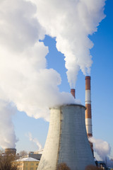 Industrial landscape with pipes against the blue sky