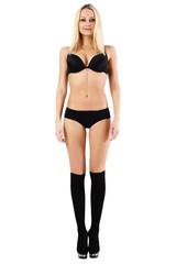 Young woman in black panties, bra and shoes.
