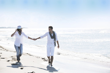 happy young couple have fun at beautiful beach