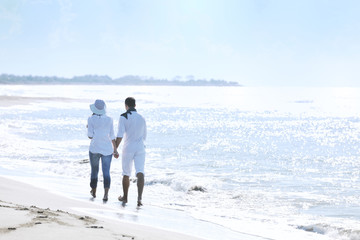 happy young couple have fun at beautiful beach