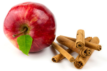 Apple and cinnamon sticks isolated on white