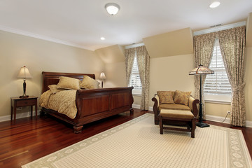 Master bedroom with cherry wood flooring