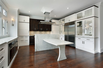 Fototapeta premium Modern kitchen with white cabinetry