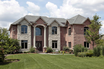 Brick home with white columns