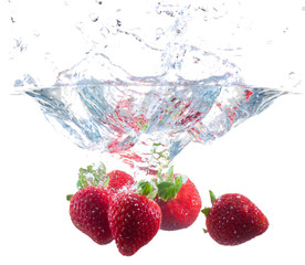 Strawberries Dropping Into Water