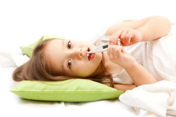 sic little girl on bed with thermometer