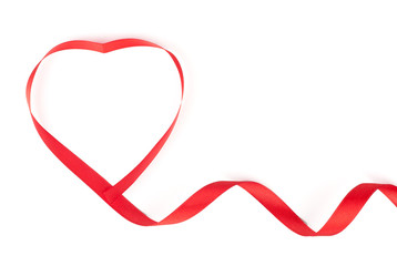 Red heart shaped ribbon on white background