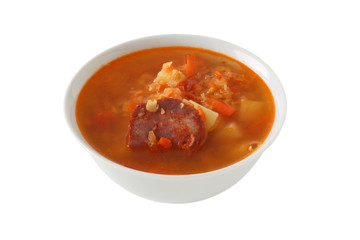 lentil soup with sausages in a bowl