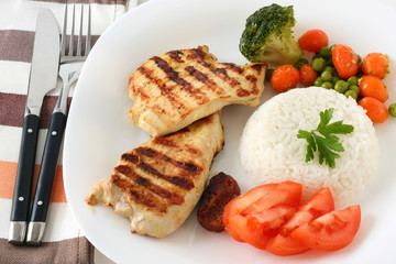 grilled chicken with rice and vegetables