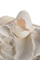 Craked egg on flour