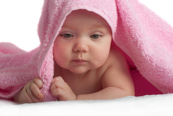 Cute baby with pink towel