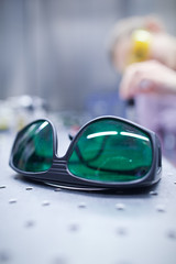 female scientist doing research in a quantum optics lab (color t
