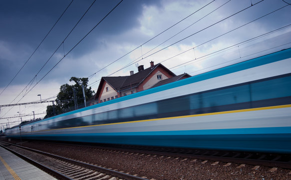 Fast train passing by (motion blur is used to convey movement)