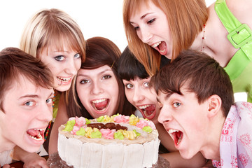 Group of happy young people with cake.