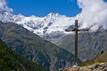 Religious cross in the swiss alps
