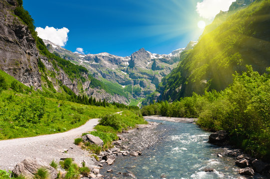 Idyllic alpine valley in sun rays. Sixt Fer a Cheval, France.