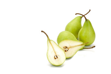 three  whole green pears and one halved