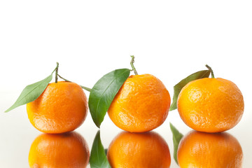 Fototapeta na wymiar Three Tangerines Closeup